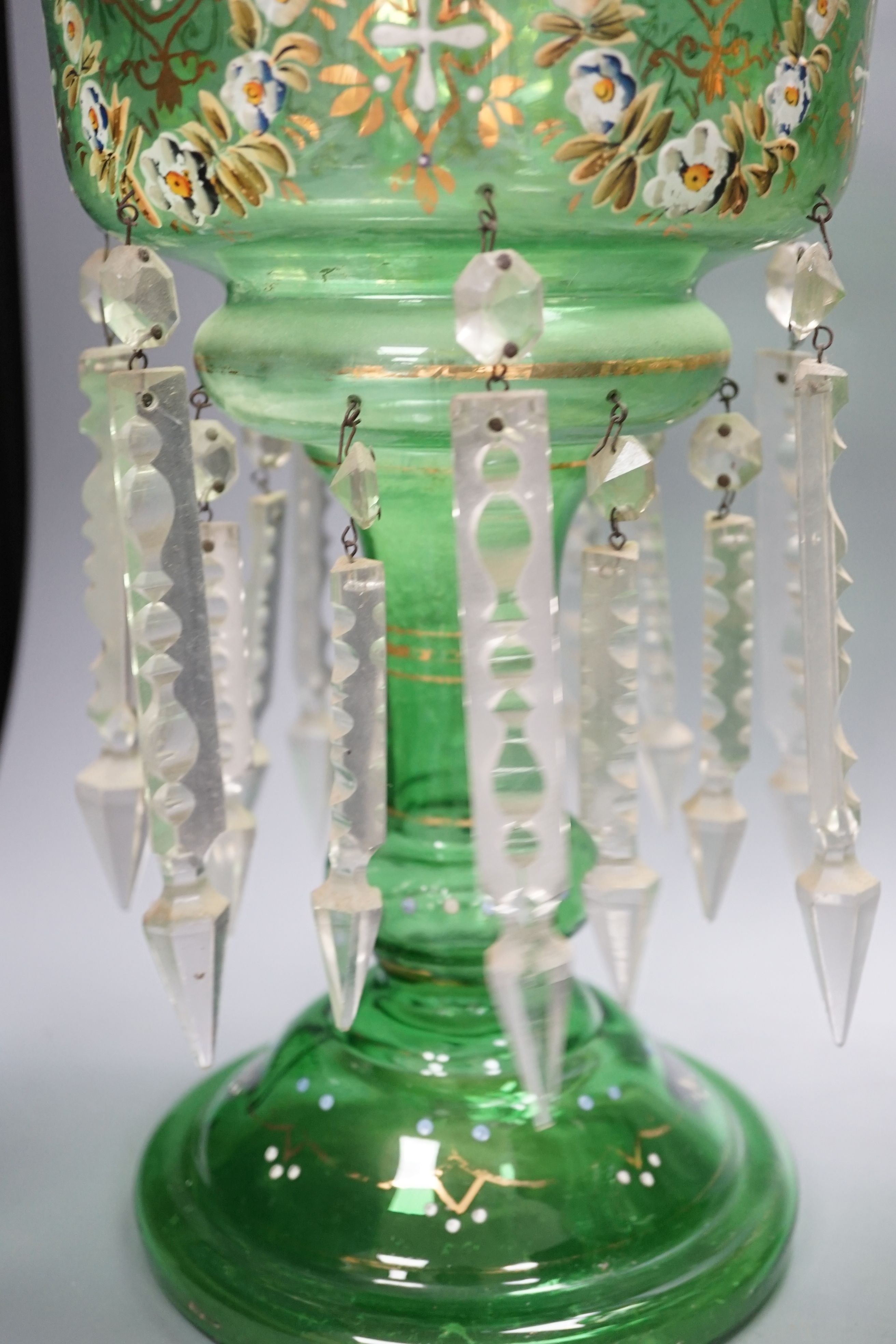 A pair of late 19th century green glass enamel lustres - 37cm high